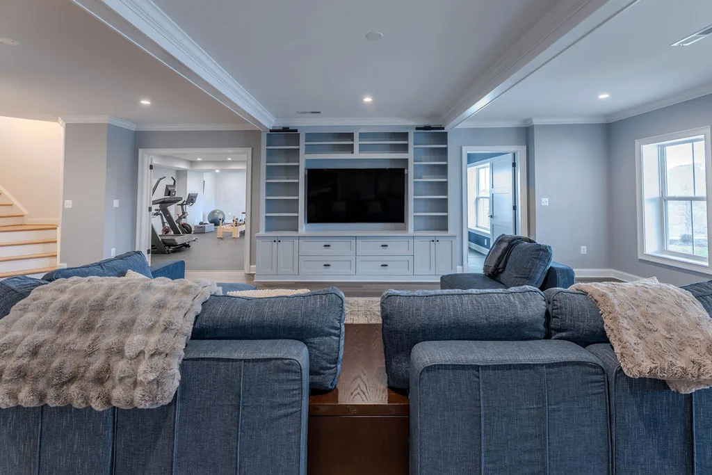 Basement sauna, living, fitness, and wet bar